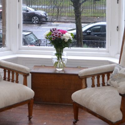 2 antique chairs re-upholstered in Villa Nova Marka fabric with antique studding
